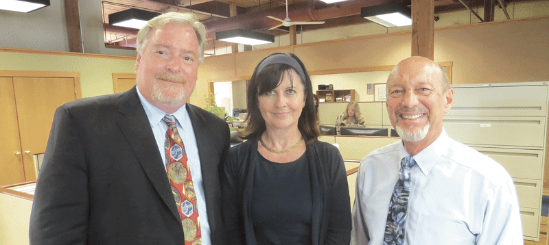 Bob Cummings, seen here with Clodagh Parker, director of Flexible Compensation Services, and Herb Mayer Jr.,