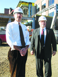 Bill Aquadro, left, and Steve Killian stand in the shadow of Cooley Dickinson Hospital’s $40 million expansion project.