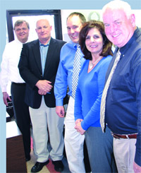 The leadership team at Entré Computer, from left, Bob Bellamy, Andi Aigner, Robert Braceland, Liz Soticheck, and Norm Fiedler. 