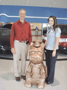 Mike Dubois, left, vice president of Finance for Balise Motor Sales, and Balise graphic artist Crystal Childs