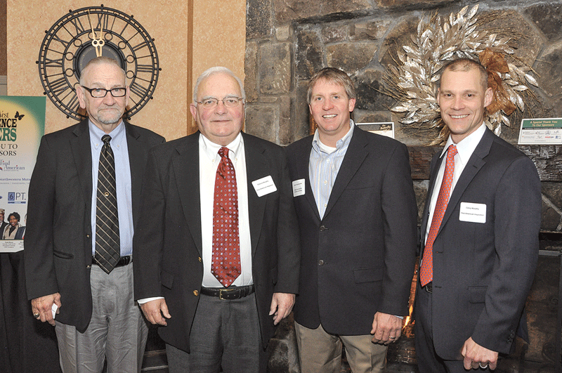 Corey Murphy, far right, president of First American Insurance, one of the event sponsors, with, from left, team members Dennis Murphy, document processor, and Edward Murphy, chairman, network with Adam Quenneville, president of Adam Quenneville Roofing and Siding (second from right). 