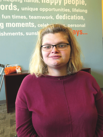 Kori Cox, a participant in Sunshine Village’s community-based day services, describes herself as an ambassador committed to generating positive thinking. 