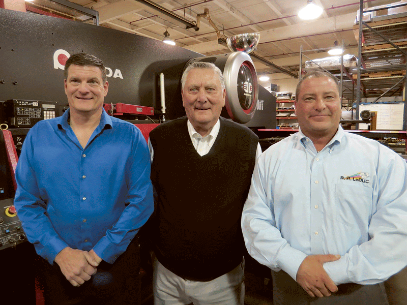 Bob LeDuc, seen here with sons Kurt, left, and Eric, started in a chicken coop and has recorded steady growth ever since.