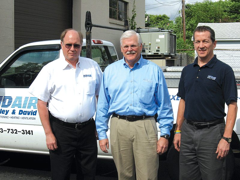 Ward Woodruff (center), with service manager Walter Thayer (left) and Mark Kent