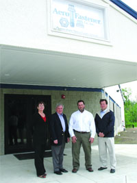 From left, Patricia Titcomb, executive assistant at Aero Fastener; James Avery; Kevin Donovan; and Michael Byrnes outside the new facility.