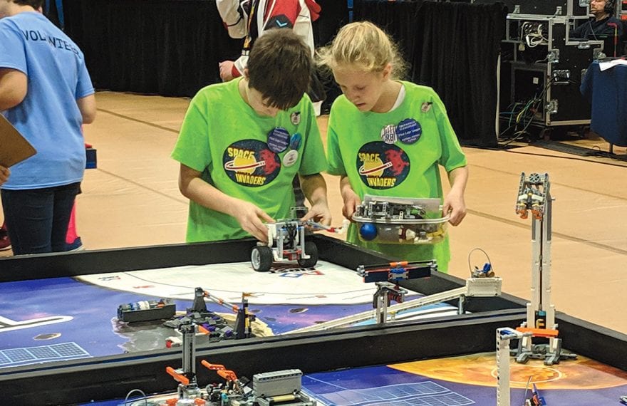 A team from Feeding Hills gets ready to put their robot to the test.