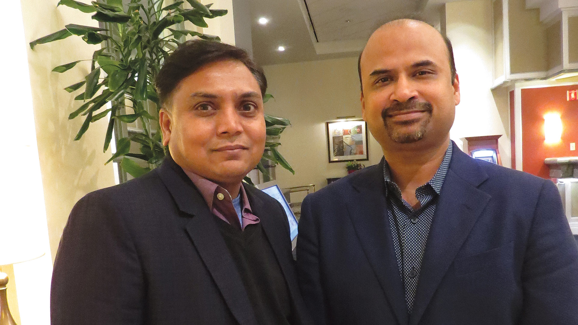 Dinesh Patel, left, and Vid Mitta in the soon-to-be-renovated lobby of the Tower Square Hotel.