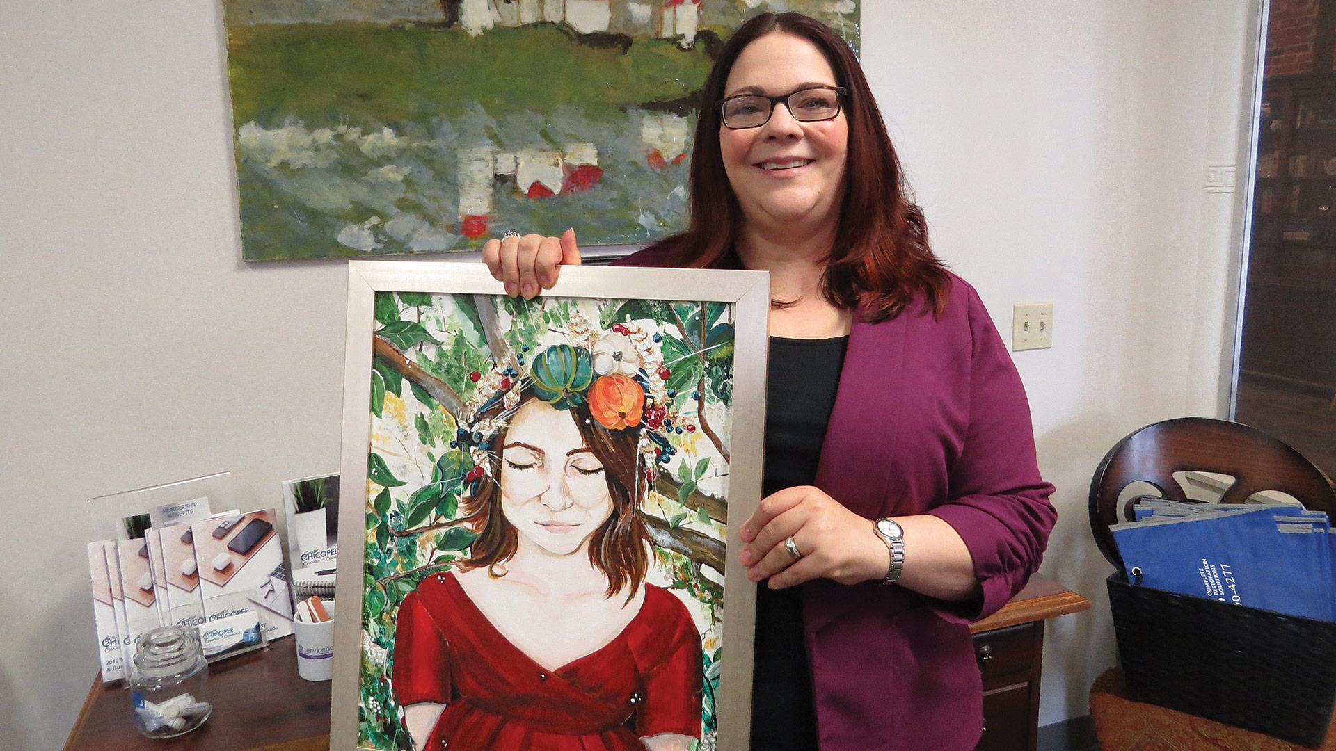 Jessica Roncariti-Howe, here displaying one of her own paintings