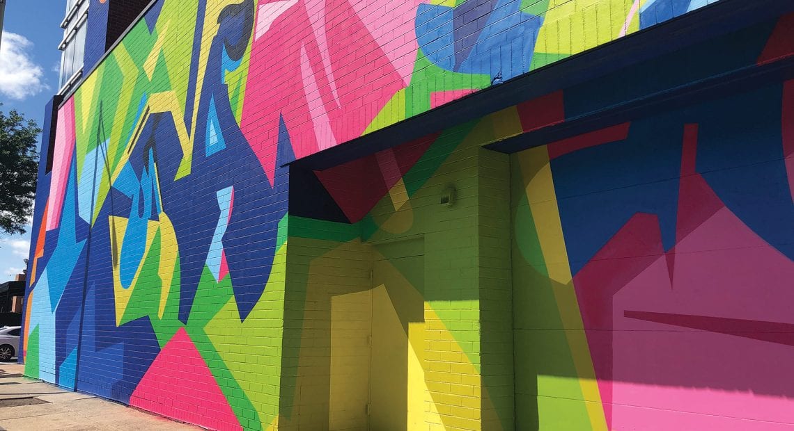 The East Columbus parking garage after being colorfully decorated by artist Wane One from the Bronx, N.Y.