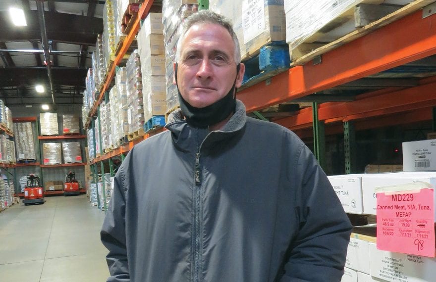 Andrew Morehouse stands in the warehouse at the Food Bank’s complex in Hatfield.