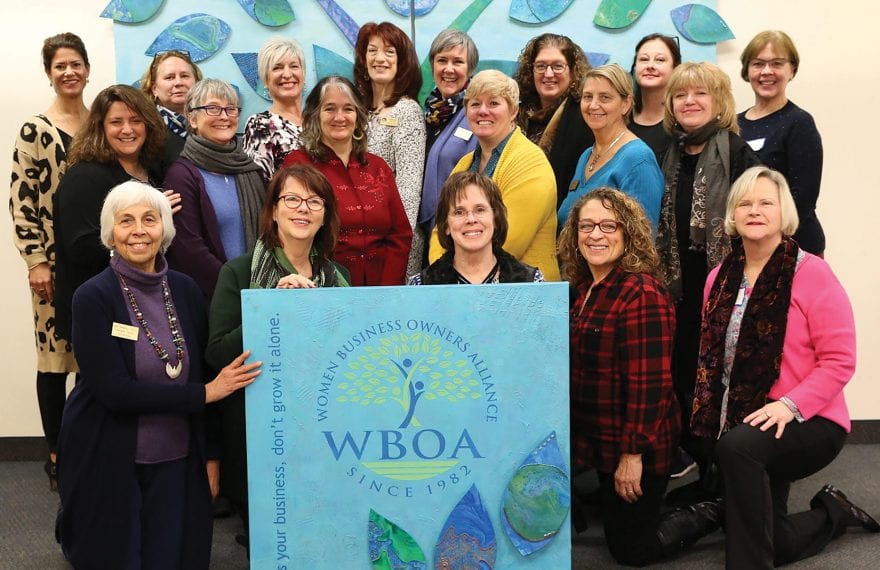 The WBOA team with a mural