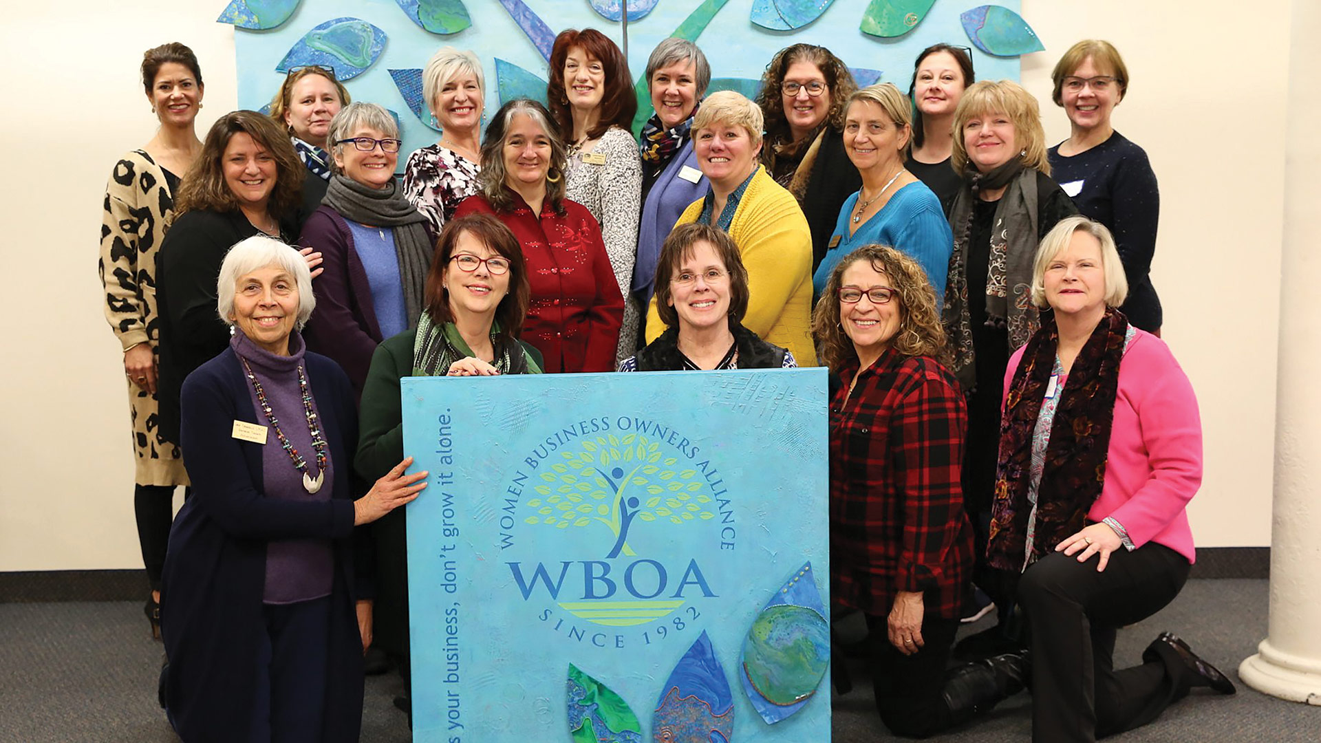 The WBOA team with a mural