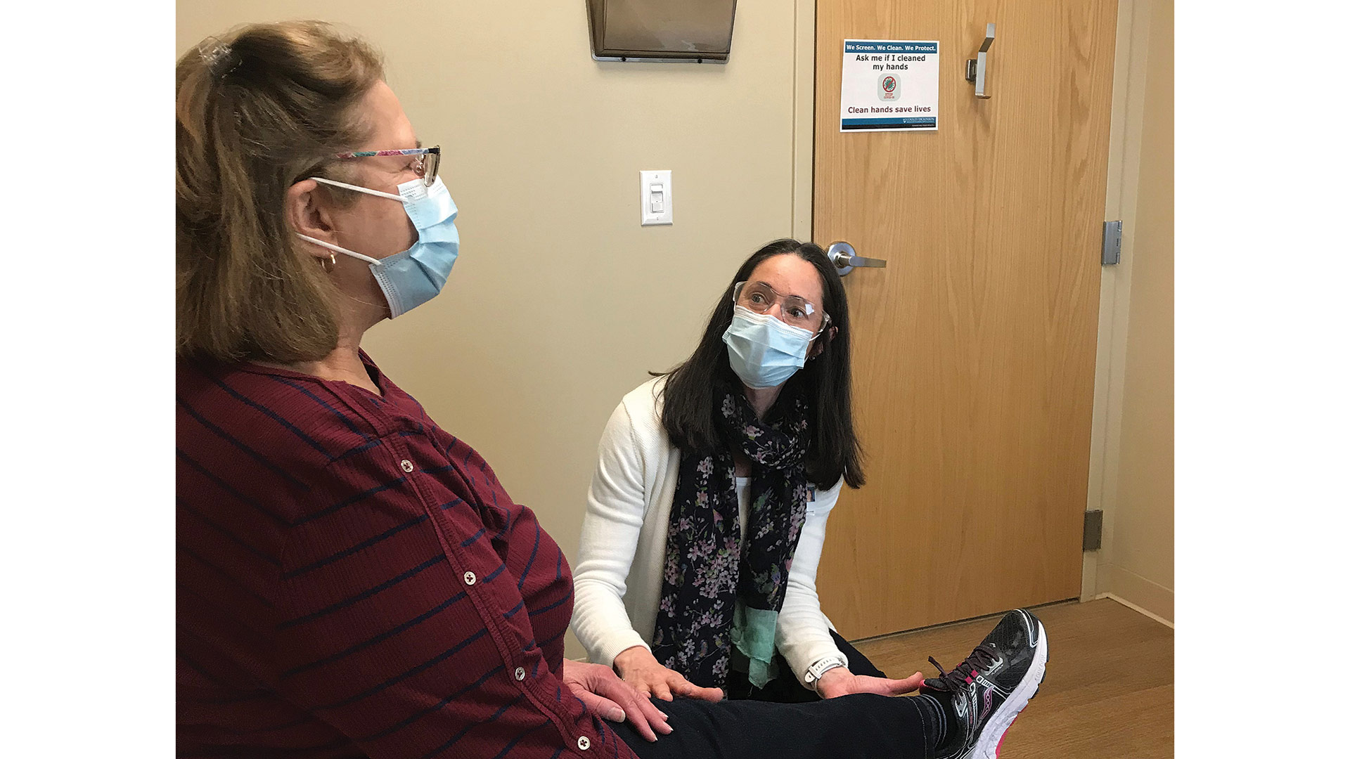 Andrea Noel-Doubleday speaks with a joint-replacement patient.