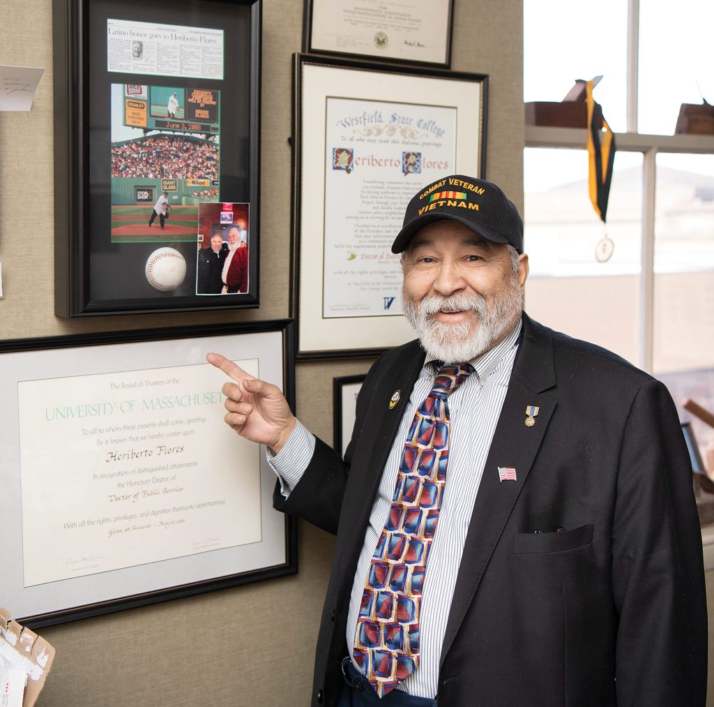 Herbie Flores’ office walls are filled with proclamations, awards, and photos of his interactions with state and national leaders.