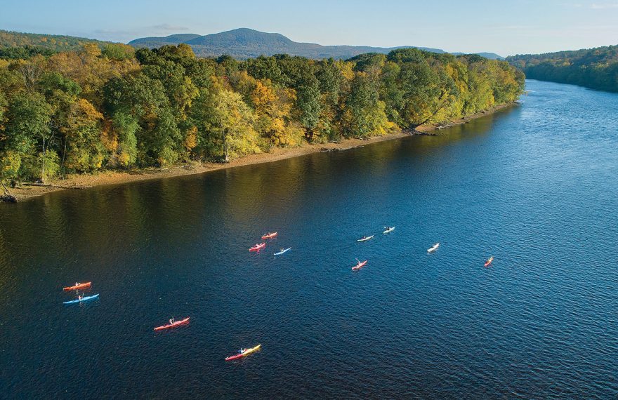 Kayakers paddle on the Connecticut River