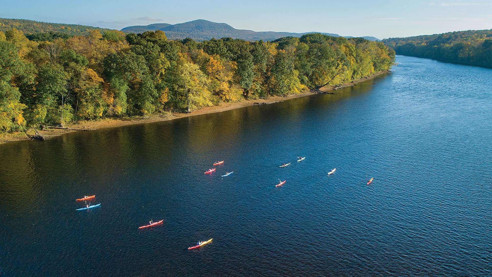 Kayakers paddle on the Connecticut River