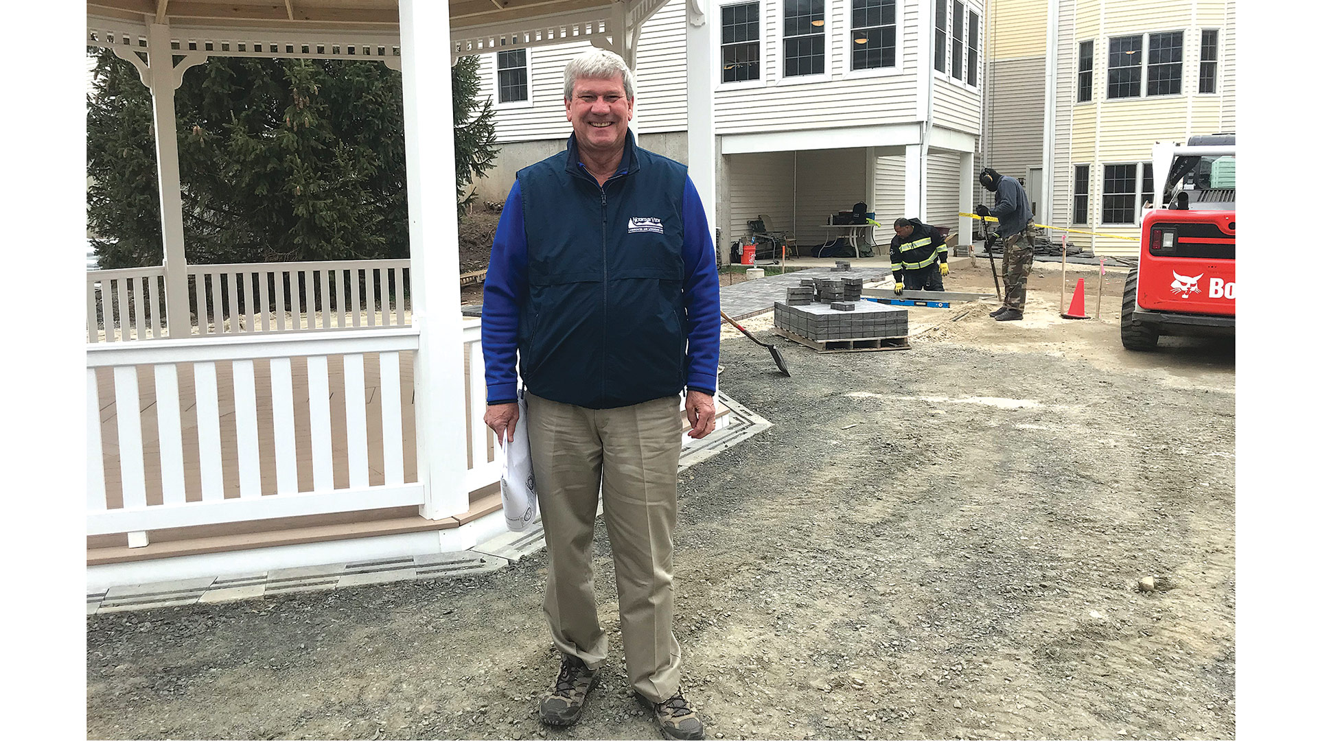 Steve Corrigan leads his crew as they install pavers at Loomis Village in South Hadley