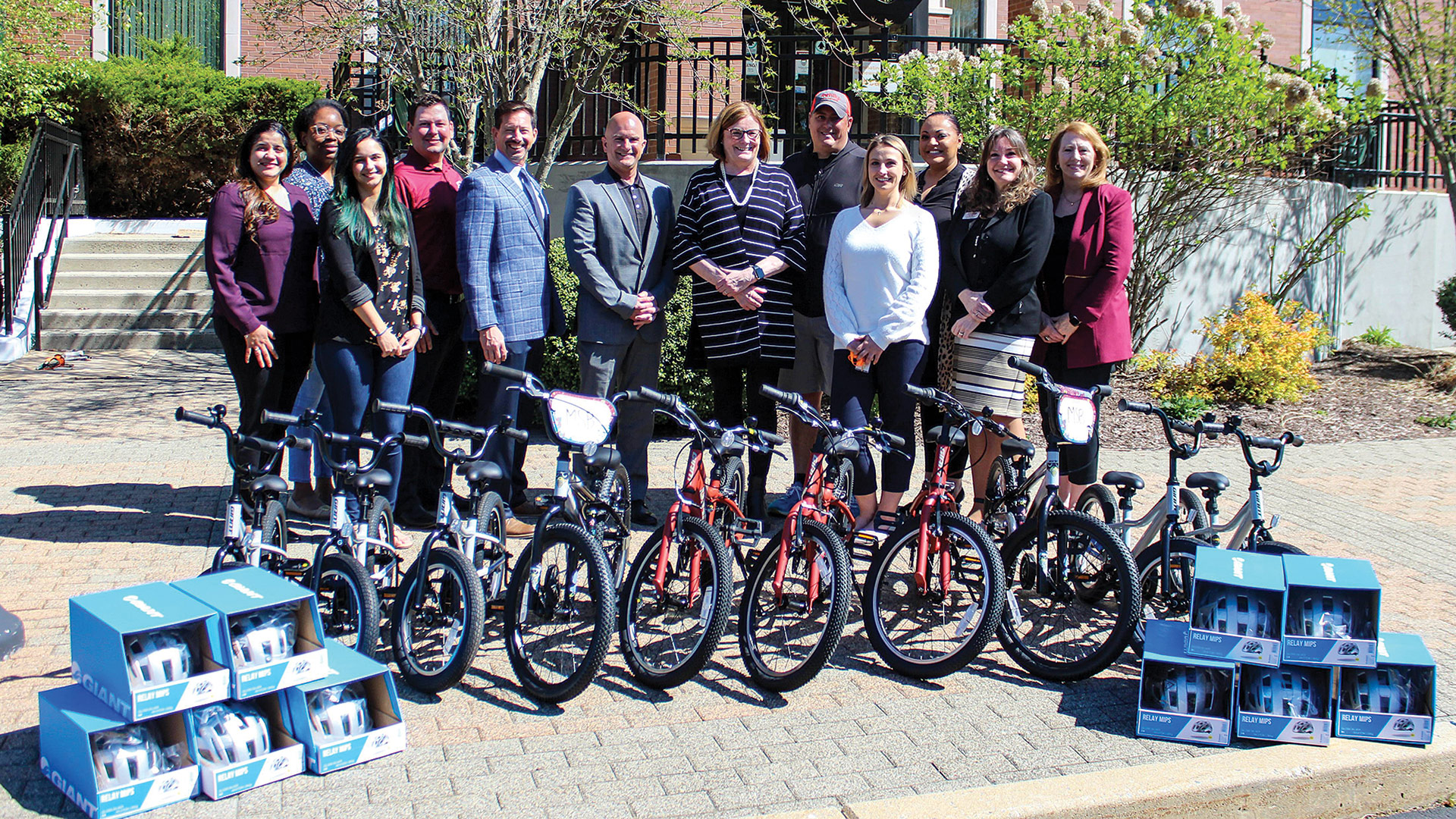 Monson Savings Bank team members deliver bicycles to the YWCA of Western Massachusetts