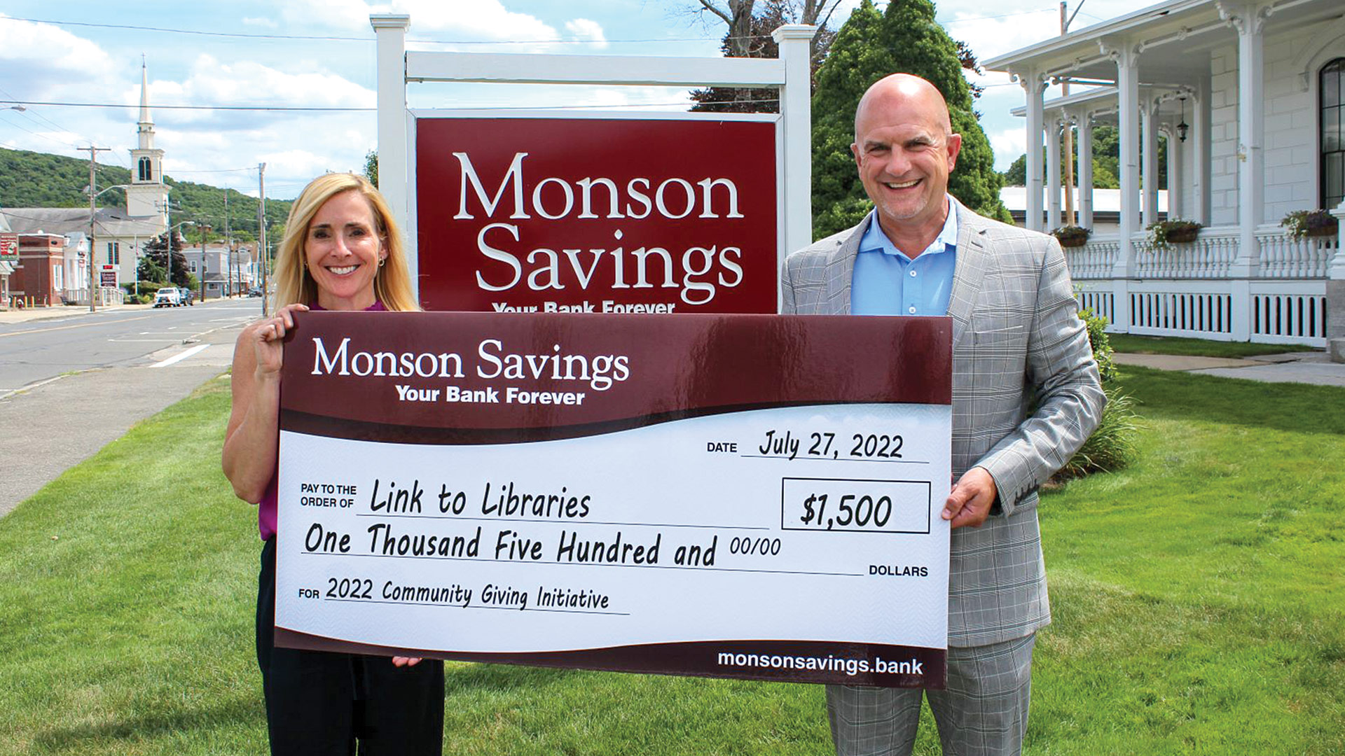 Moriarty presents Laurie Flynn, president and CEO of Link to Libraries, with a $1,500 donation as a part of the bank’s Community Giving Initiative