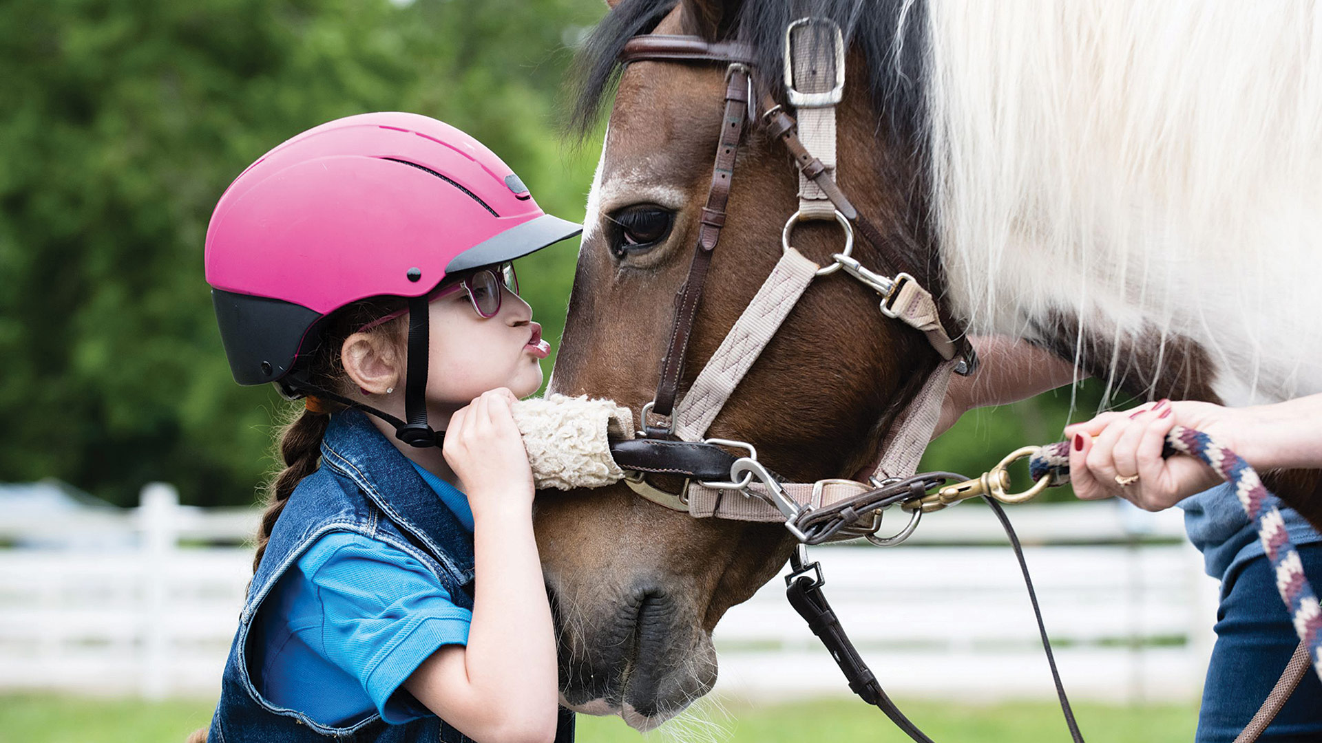 Emma Boyer-Martinez, a 7-year-old from Holyoke who lives with disabilities that make some activities more difficult for her, but loves horses and riding and takes part in therapeutic lessons that help her build strength and balance
