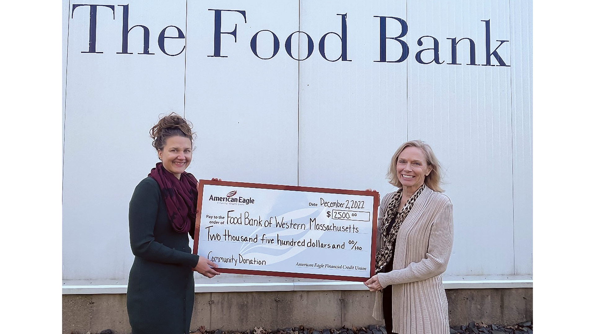 Pictured: Teresa Knox, COO of American Eagle Financial Credit Union (right), presents the $2,500 donation to Jillian Morgan, director of Philanthropy at the Food Bank of Western Massachusetts.