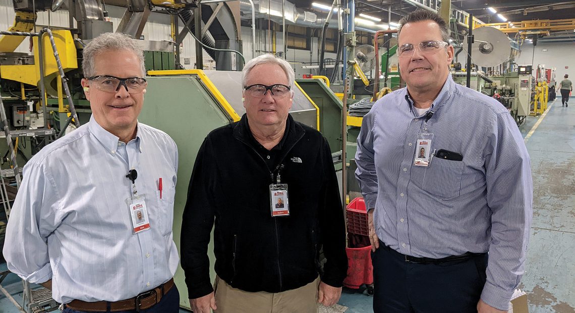 From left, Web Shaffer, Hubert McGovern, and Dewey Kolvek on one of the plant floors at OMG Inc.