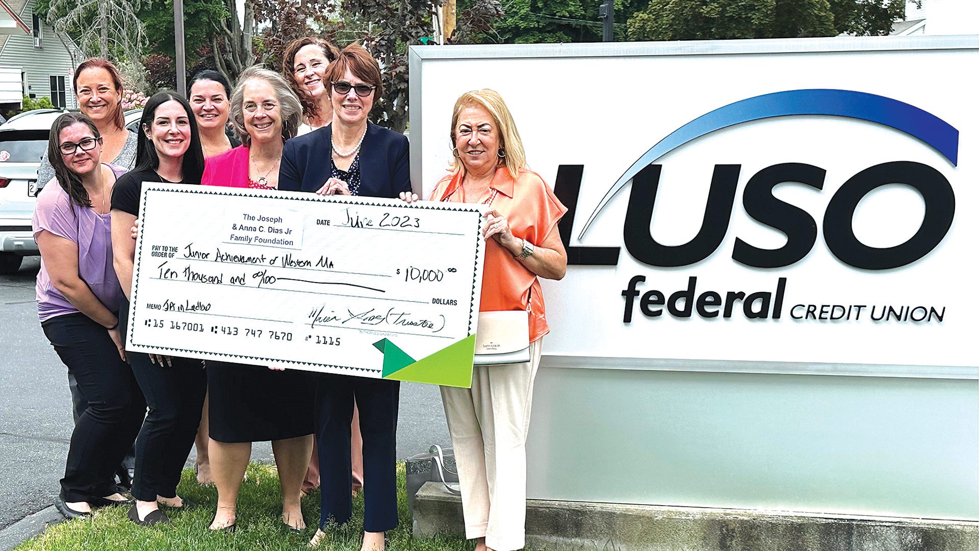 Pictured: Joseph & Anna C. Dias Jr. Family Foundation trustee Maria Gomes (far right) presents the $10,000 check to JAWM President Jennifer Connolly (second from right) alongside a group of LUSO employees.