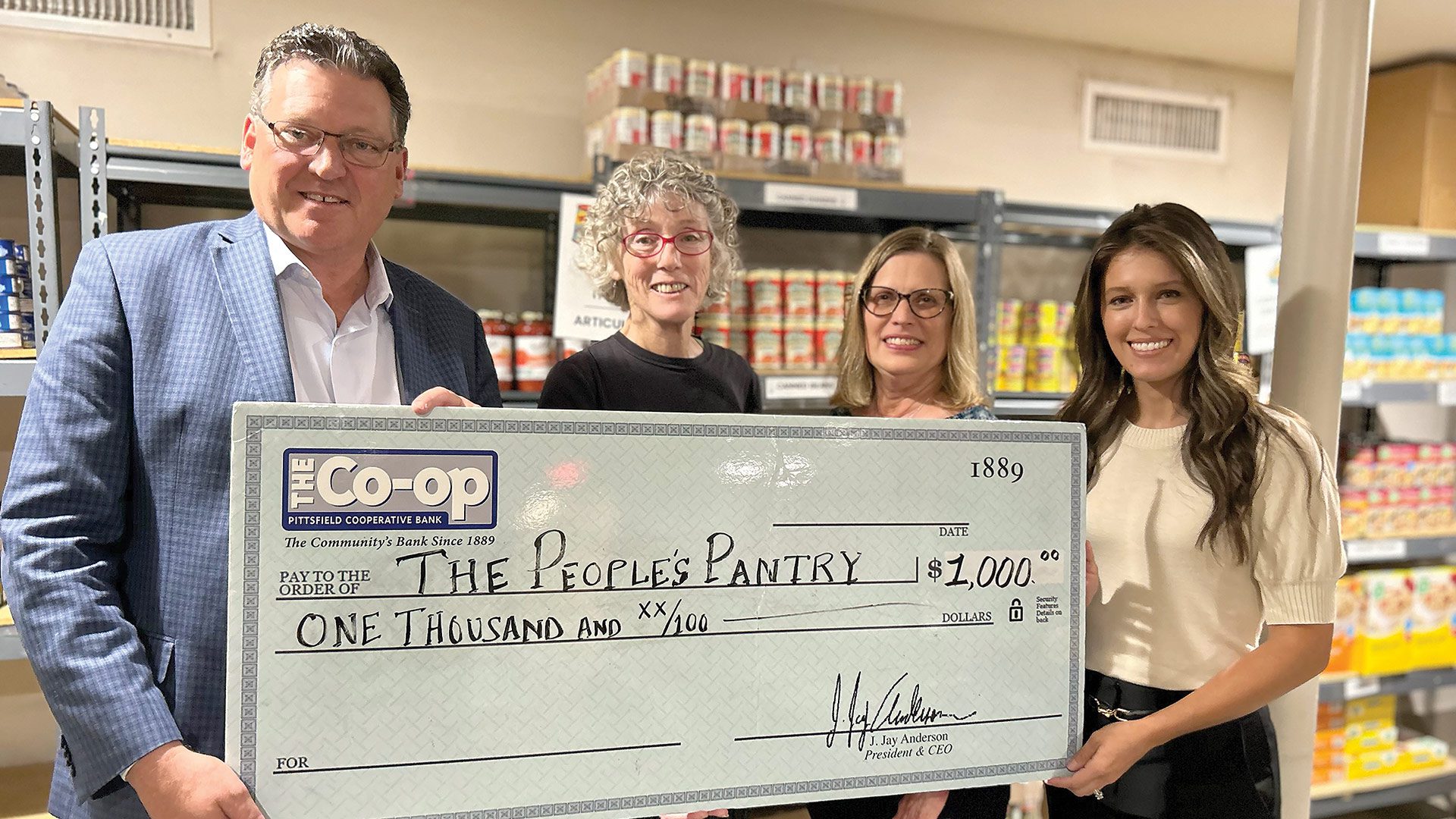 J. Jay Anderson (left), president and CEO of Pittsfield Cooperative Bank, recently presented a $1,000 donation from the bank to the People’s Pantry in Great Barrington