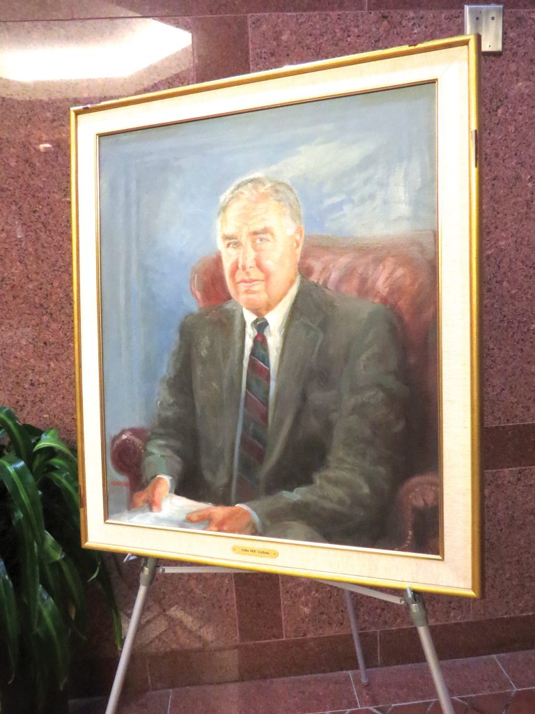 A framed portrait of John Collins