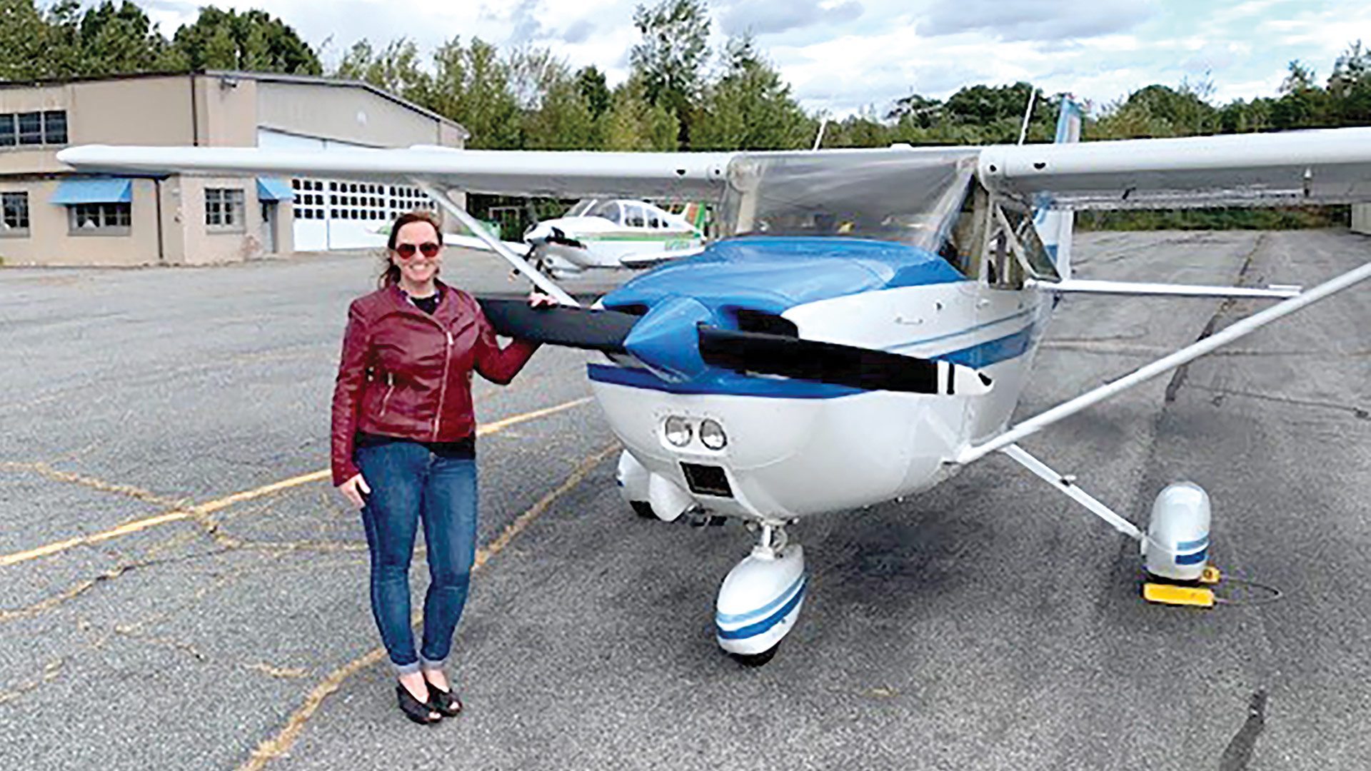 Rika Ballard with ‘Blu,’ the plane with which she started Fly Lugu; she has added many to the fleet since.