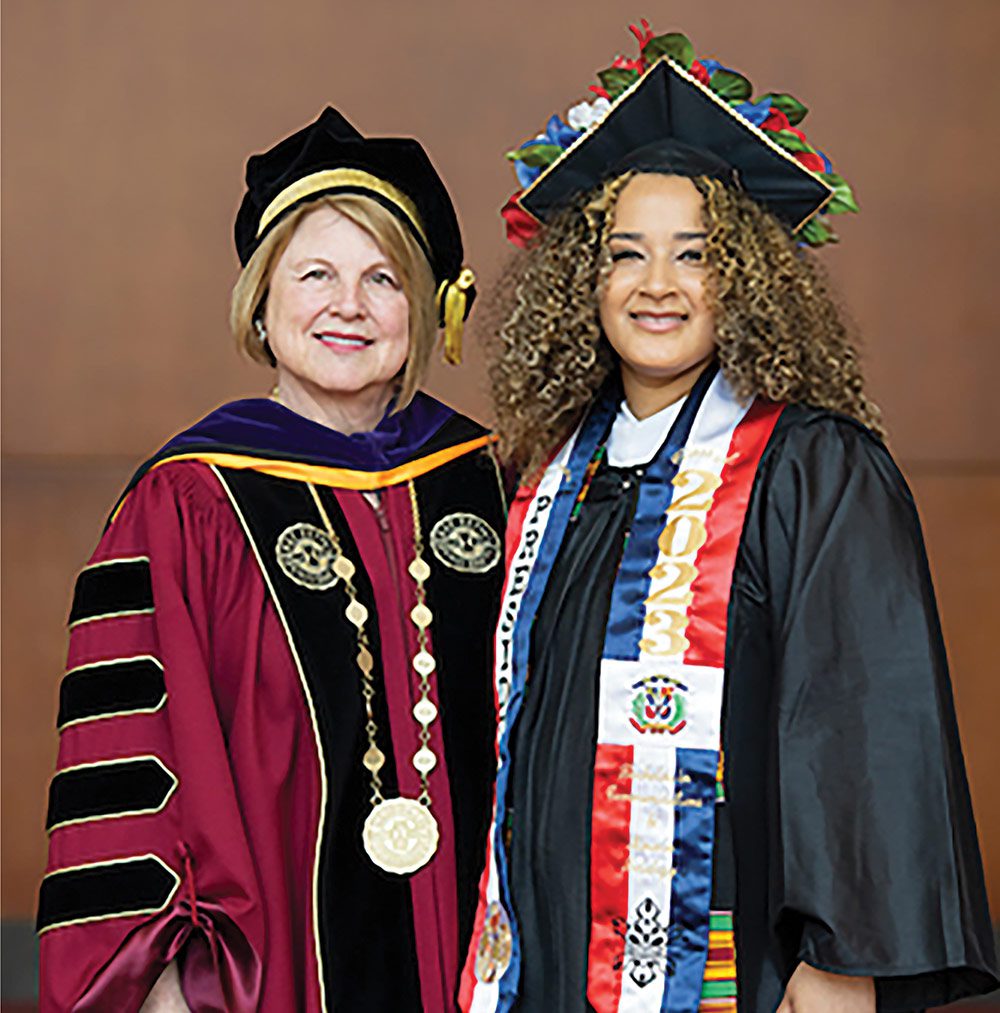 Sandy Doran, left, with student speaker Diane Almonte Arias