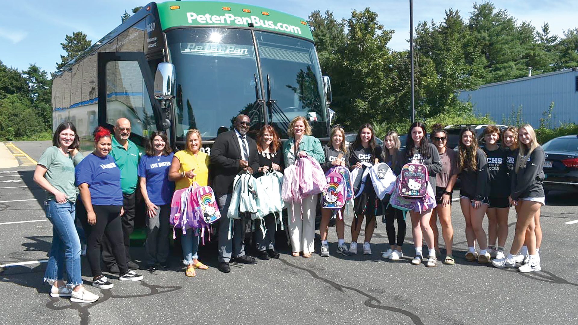 With the Peter Pan bus fully packed, United Way staff and volunteers climbed aboard and trekked through 10 school districts to drop off more than 600 backpacks for students experiencing homelessness