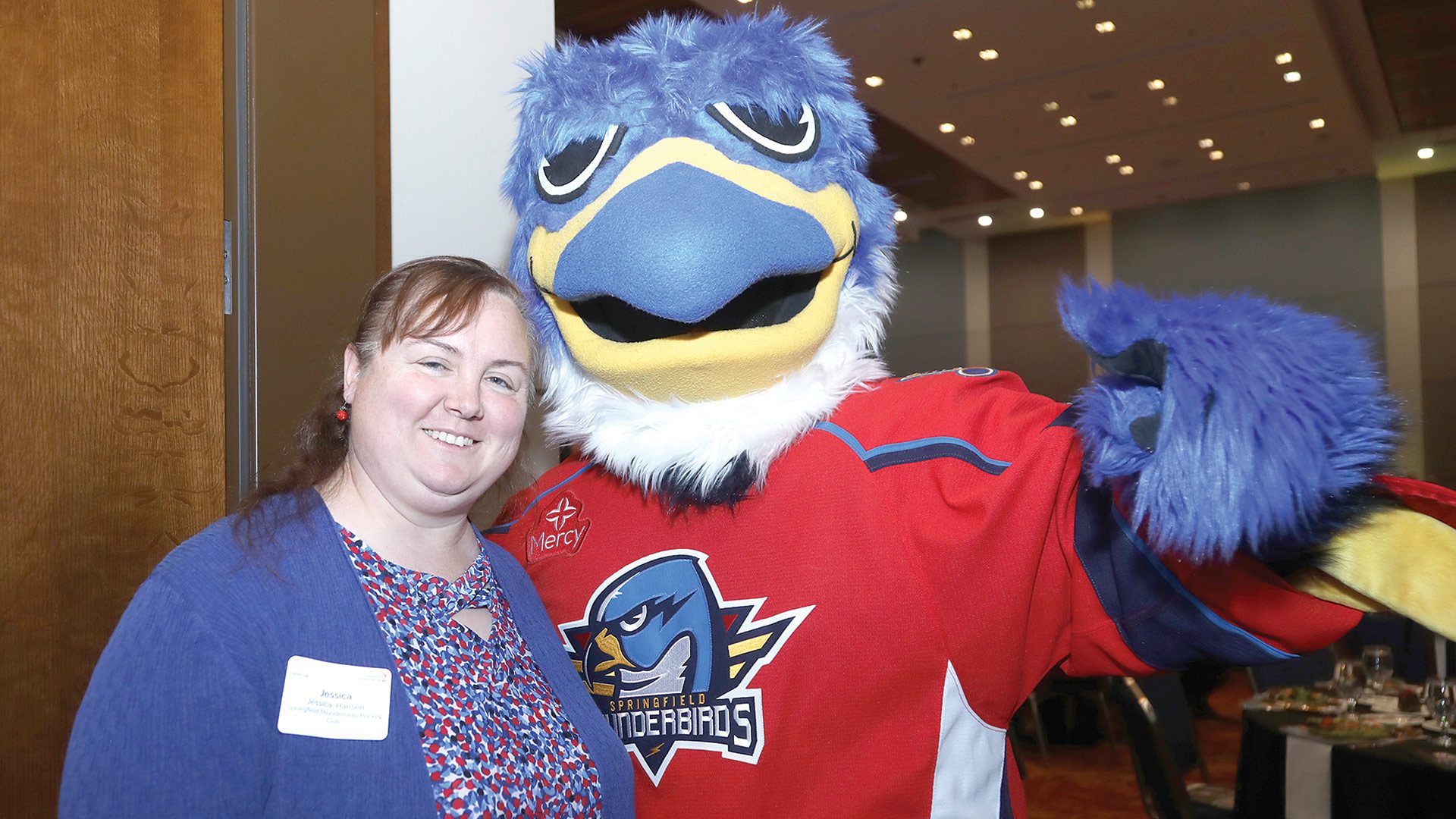 Jessica Hansen and Boomer from the Springfield Thunderbirds, honored in the Growth and Give Back categories