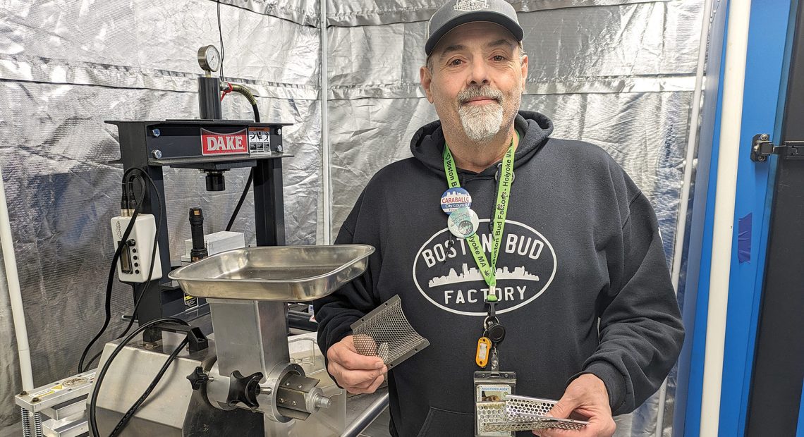 Frank Dailey shows off some equipment used to grind cannabis.