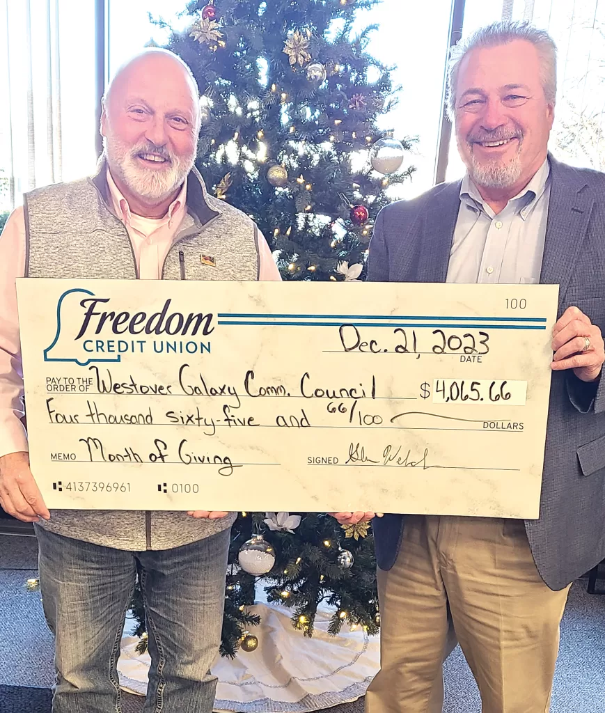 Freedom Credit Union President Glenn Welch (right) presents a check to John Beaulieu