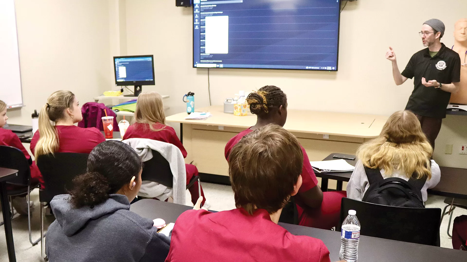 Daniel O’Neill, patient simulation information coordinator at STCC, talks to the students
