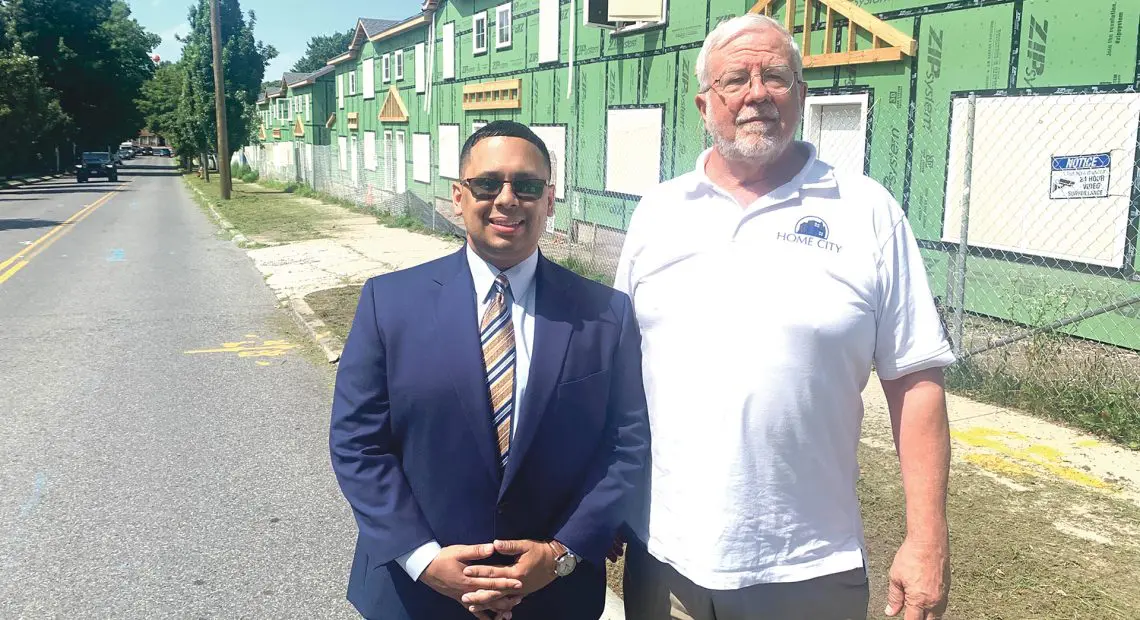 Joesiah Gonzales, left, with Home City Development Executive Director Thomas Kegelmen