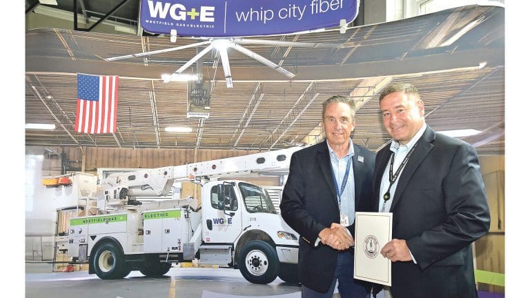 Mayor Mike McCabe, left, presents Westfield G&E General Manager Tom Flaherty