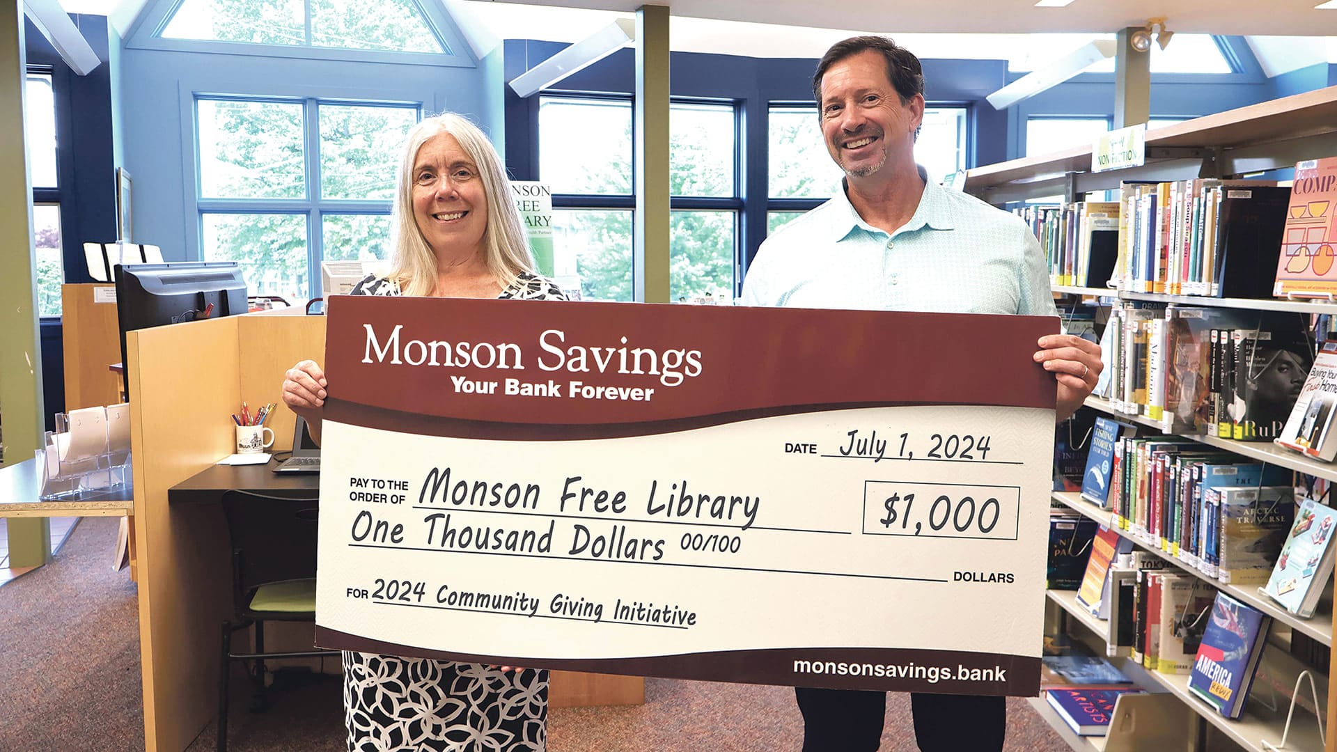 Pictured: Hope Bodwell (left), Monson Free Library director, with Michael Rouette, executive vice president and chief operating officer at Monson Savings Bank.