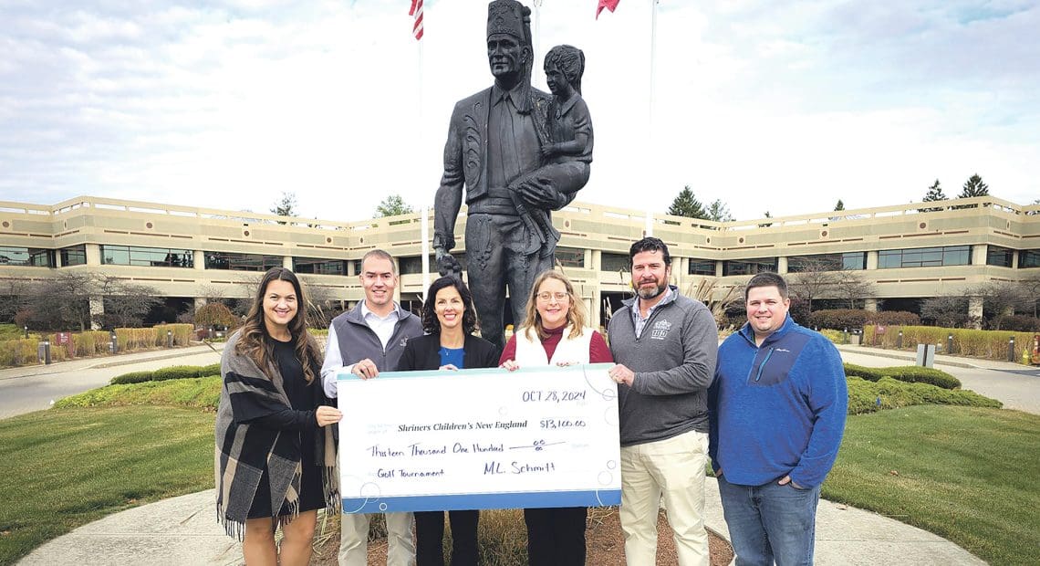 Stephanie Parent, Pete Coppez, Elizabeth Coppez, Jean Pierre Crevier, and Bousquet of M.L. Schmitt with Kerri-Lynn Tichy (fourth from left) of Shriners Children’s New England