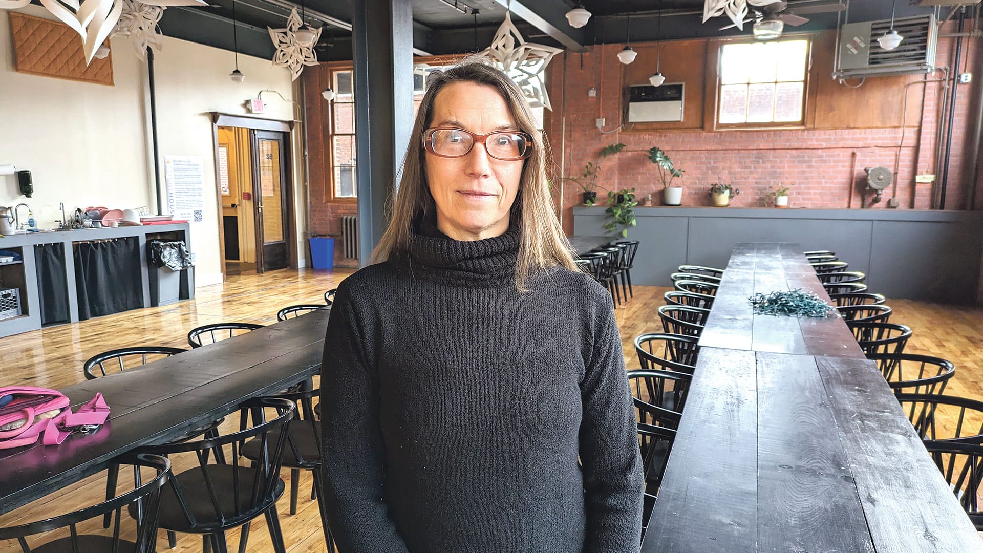 Catherine Gobron stands in the school’s dining area, where students will benefit from a just-launched in-house kitchen.