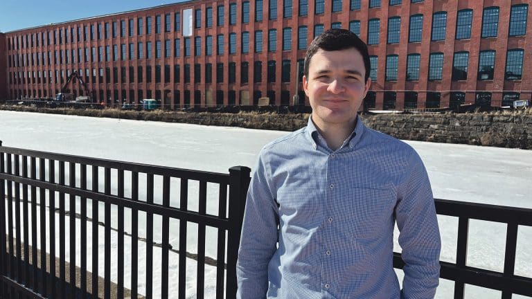 Hagop Toghramadjian stands outside phase one of the Residences on Appleton, which features 88 units of mixed-income housing.
