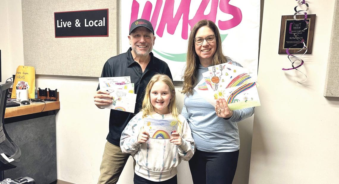 Pictured: Chris Kellogg and Dina McMahon from the WMAS Kellogg Krew with a young patient during the radiothon.
