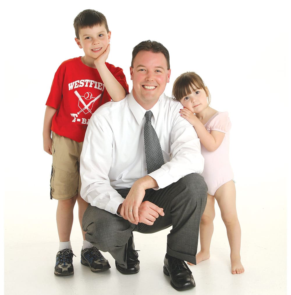 Jim Krupienski when he was named to the 40 Under Forty class of 2010, and today (top)