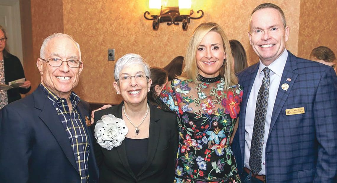 Steve and Sue Kaplan, left, with Laurie Flynn, executive director of Link to Libraries, and John Doleva, president and CEO of the Basketball Hall of Fame, a strong supporter of the agency.