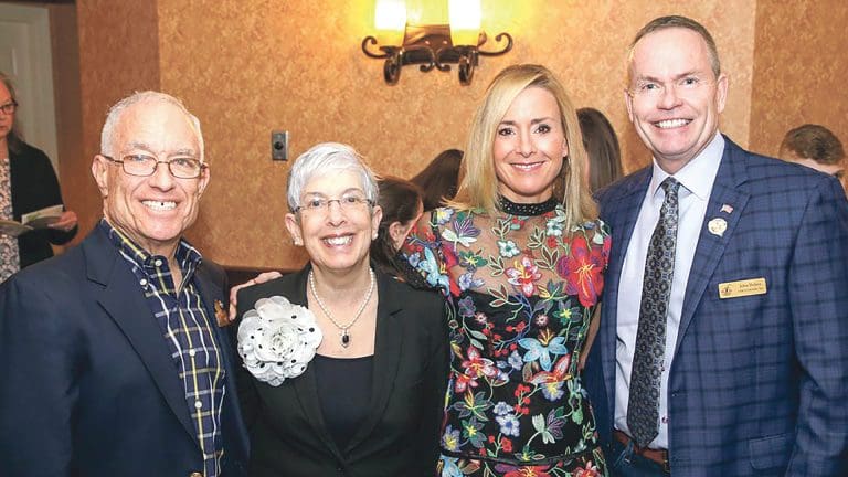 Steve and Sue Kaplan, left, with Laurie Flynn, executive director of Link to Libraries, and John Doleva, president and CEO of the Basketball Hall of Fame, a strong supporter of the agency.