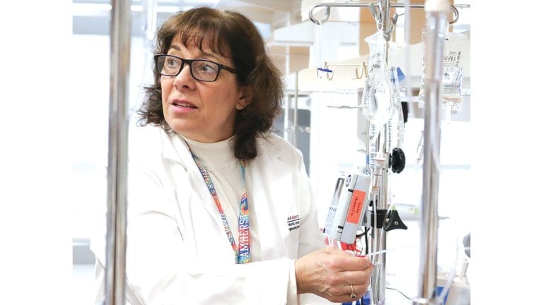 Karen Giuliano with an IV pole