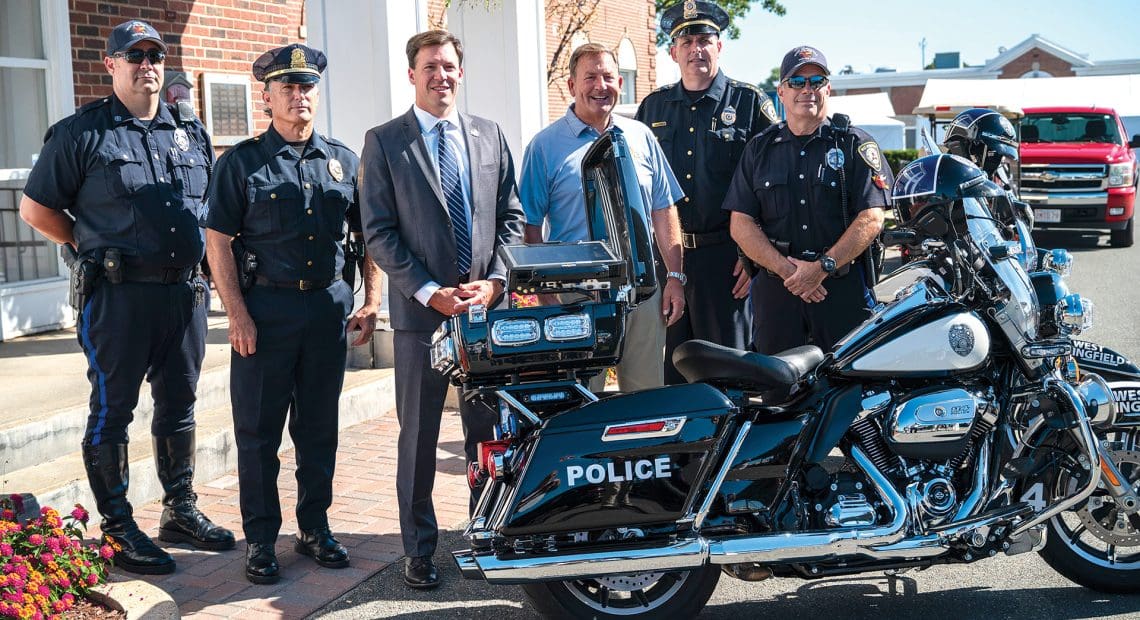 Pictured, from left: Officer Shawn Knox, Sgt. Mike Reed, West Springfield Mayor Will Reichelt, ESE President and CEO Gene Cassidy, Chief of Police Jay Gearing, and Officer Joe Reed.
