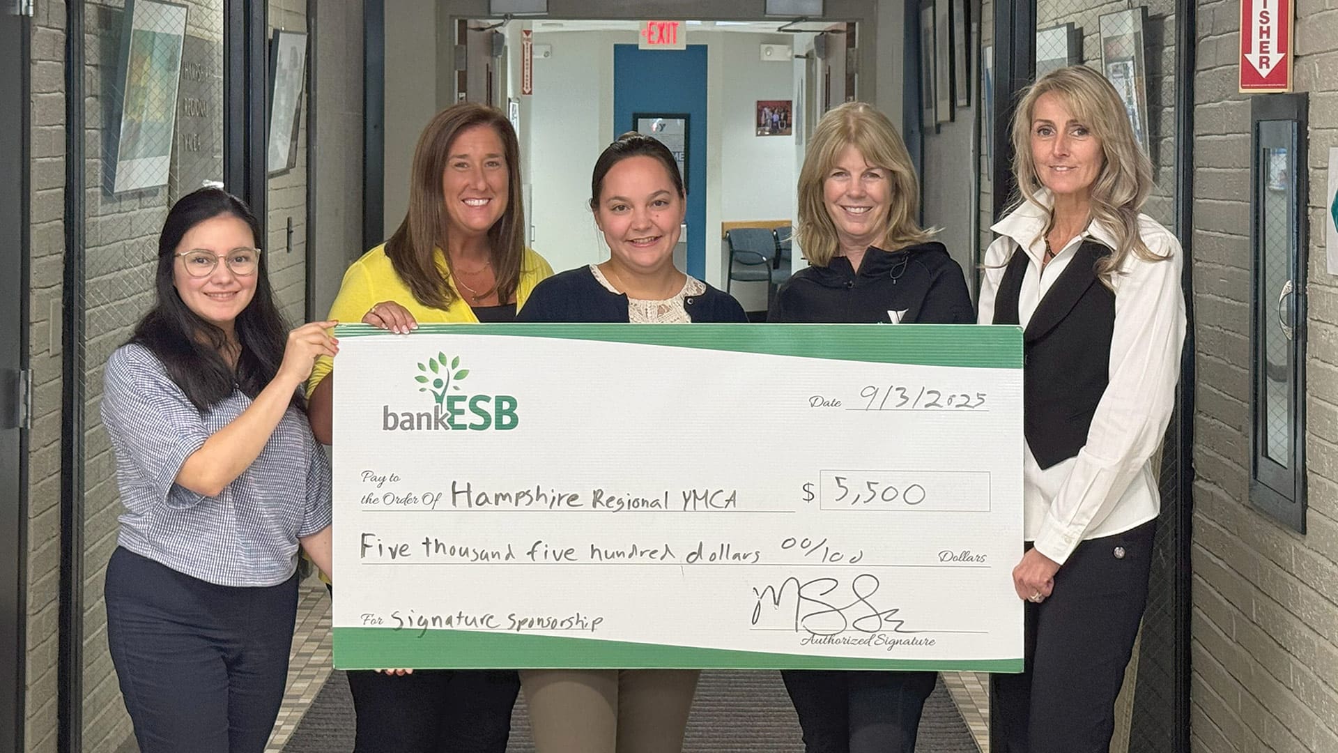 Pictured, from left: Diane Carcamo of Hampshire Regional YMCA, Lauren Tabin and Robyn Michaud of bankESB, Julie Bianco, CEO of Hampshire Regional YMCA, and Jessica West of bankESB.