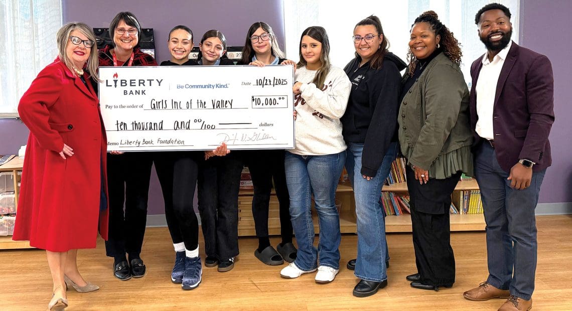 Pictured, from left: Dawn Creighton of Liberty Bank; Girls Inc. Executive Director Suzanne Parker; Girls Inc. participants; and Payton Reyes, Lakisha Coppedge, and Darryl Bonner of Girls Inc.